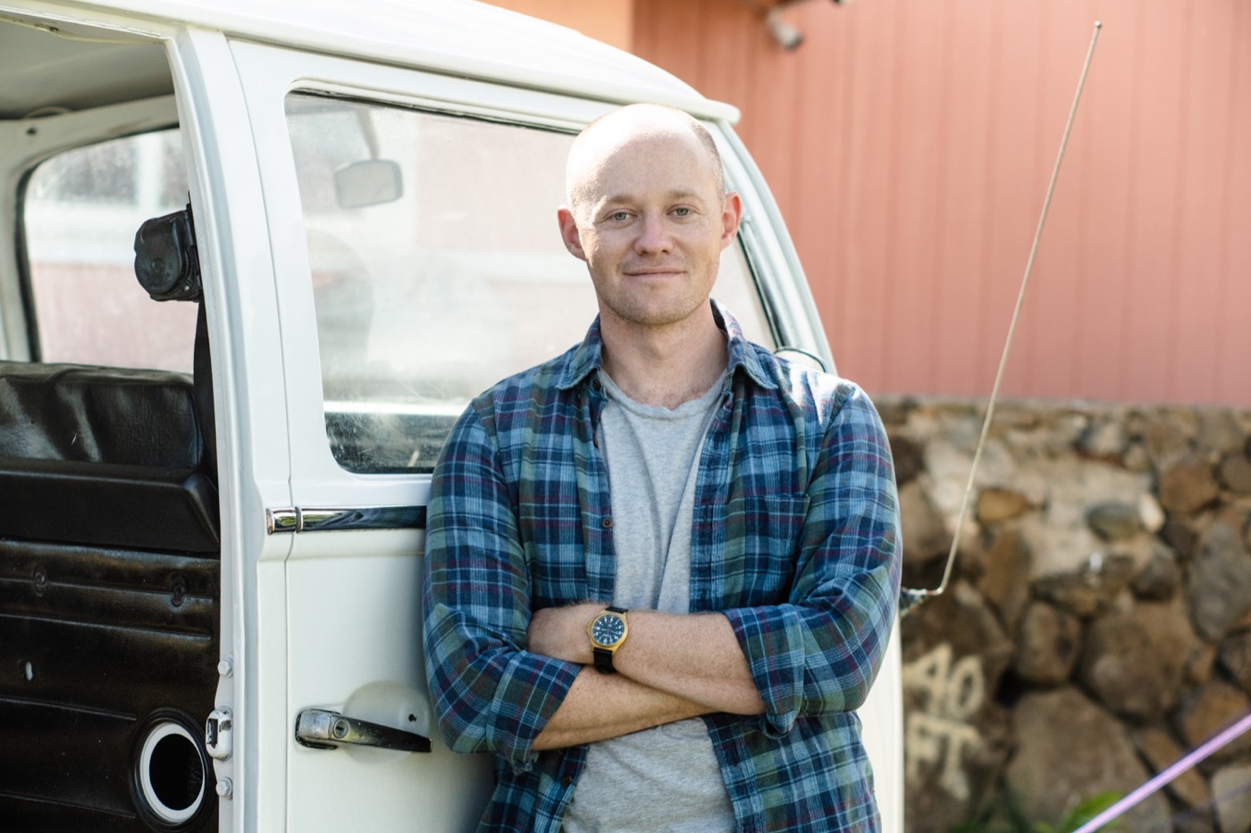 Owen Eddy standing beside a vintage van